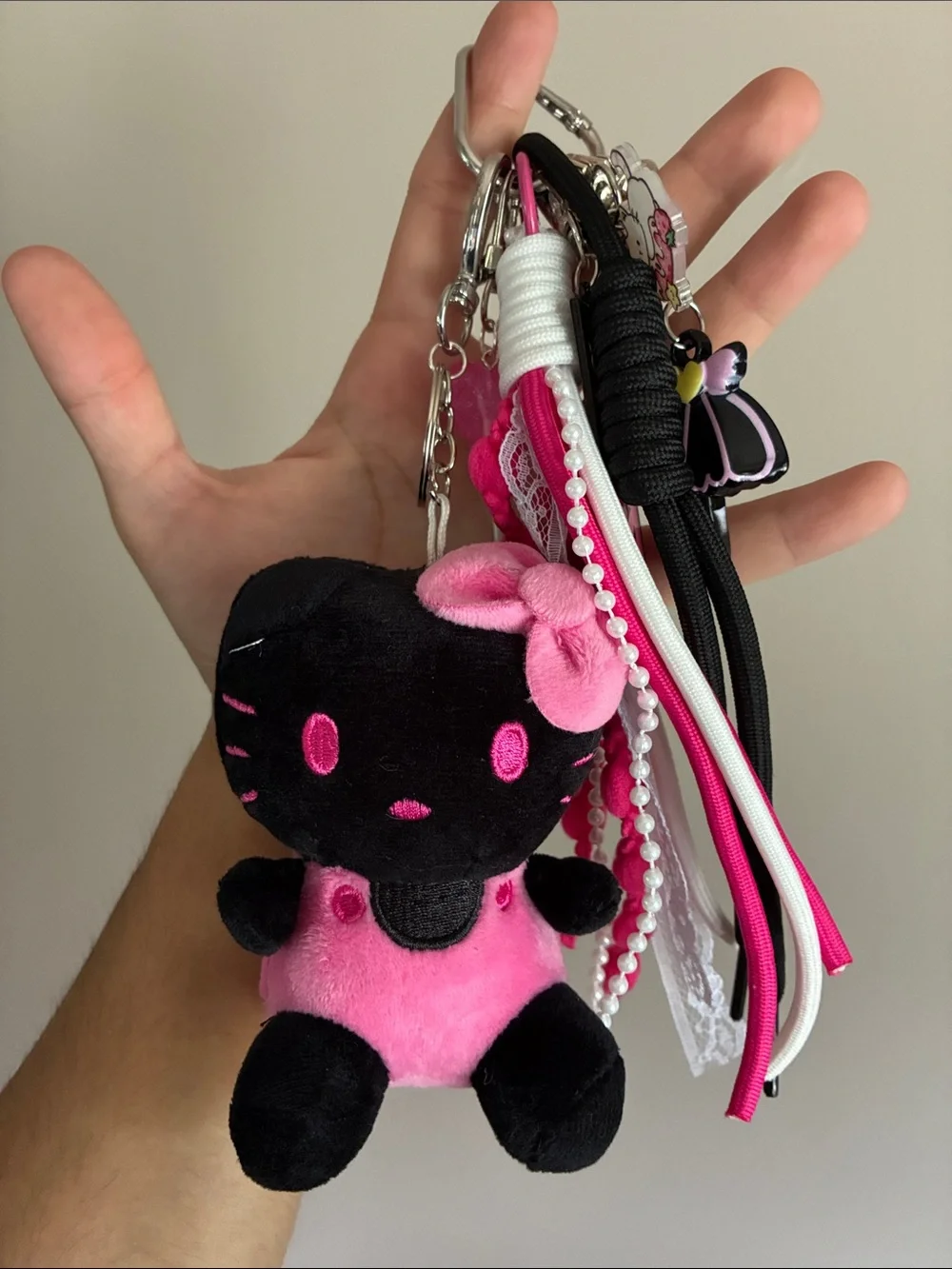 Black & Pink Plush Hello Kitty Keychain with Decorative Straps and Charms